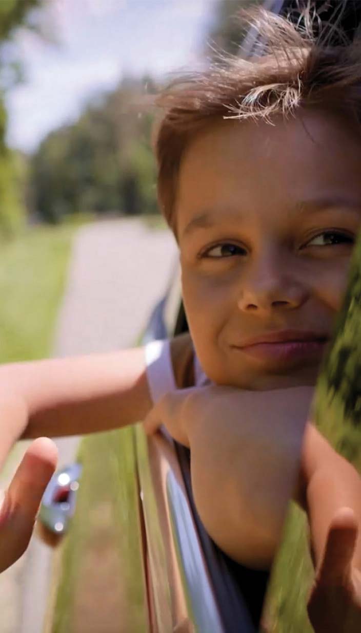 child looking out car window