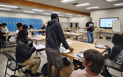 People around tables in a SEAT Center classroom.