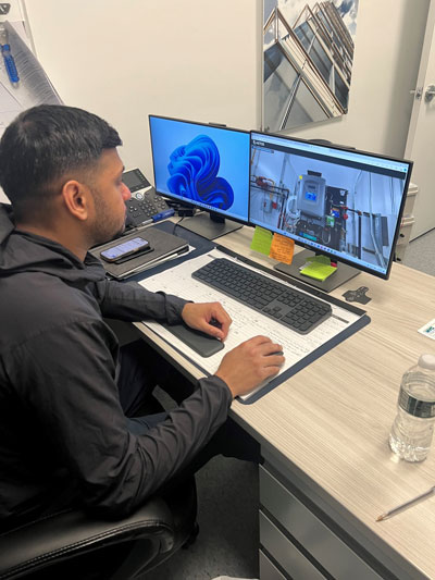 Person at a computer using the virtual SL Green + Aetos 3D training.